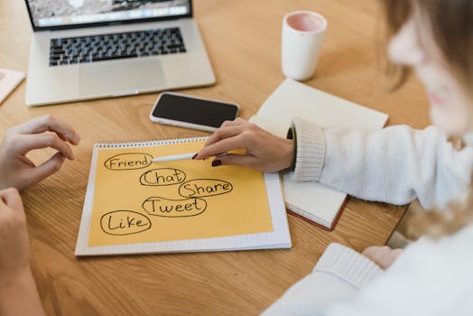 “Hands analyzing content marketing and email campaign data on a laptop with reports in a modern workspace”